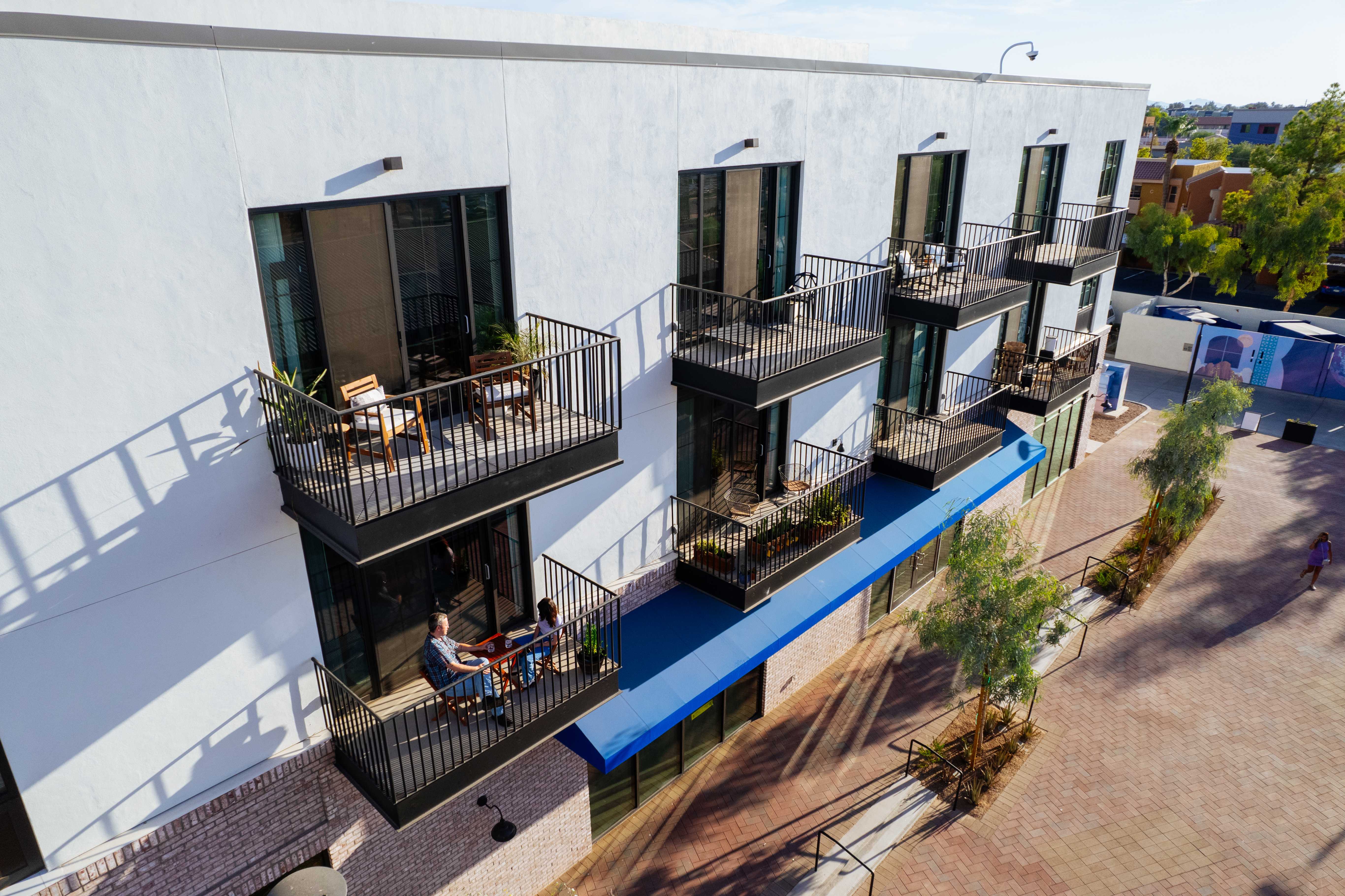 Building exterior showing multiple private balconies