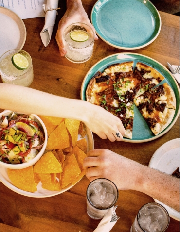 Food and drinks on a table at Cocina Chiwas