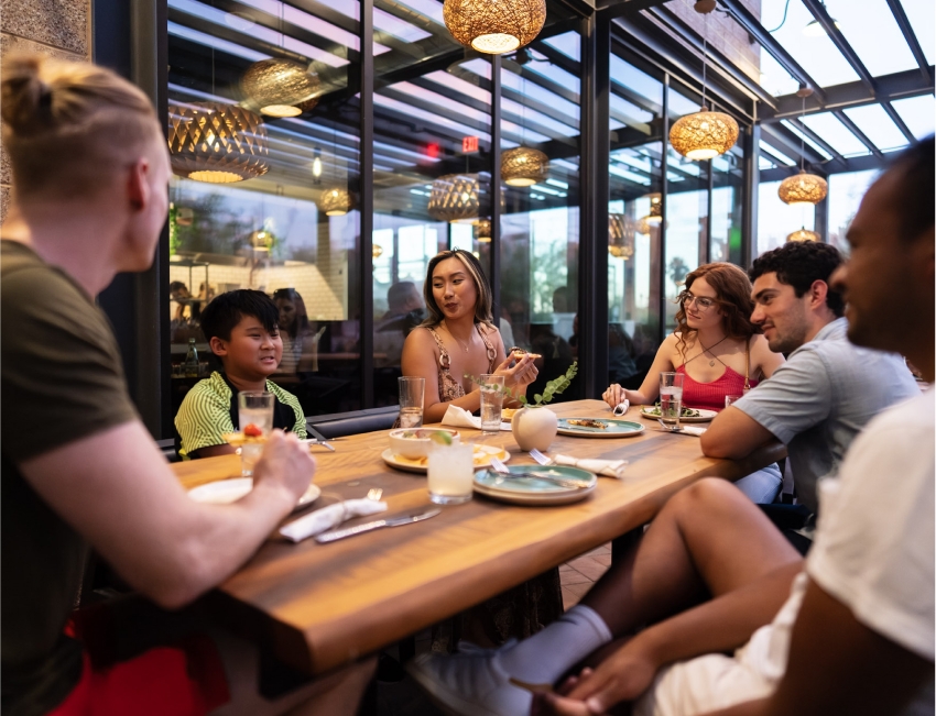 People eating outside on the Cocina Chiwas patio